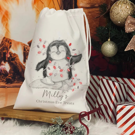 Personalised Christmas Eve Bag. christmas penguin red lights design