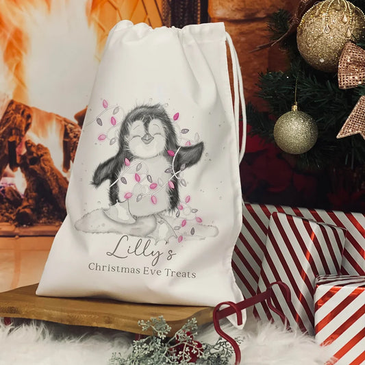 Personalised Christmas Eve Bag. christmas penguin pink lights design
